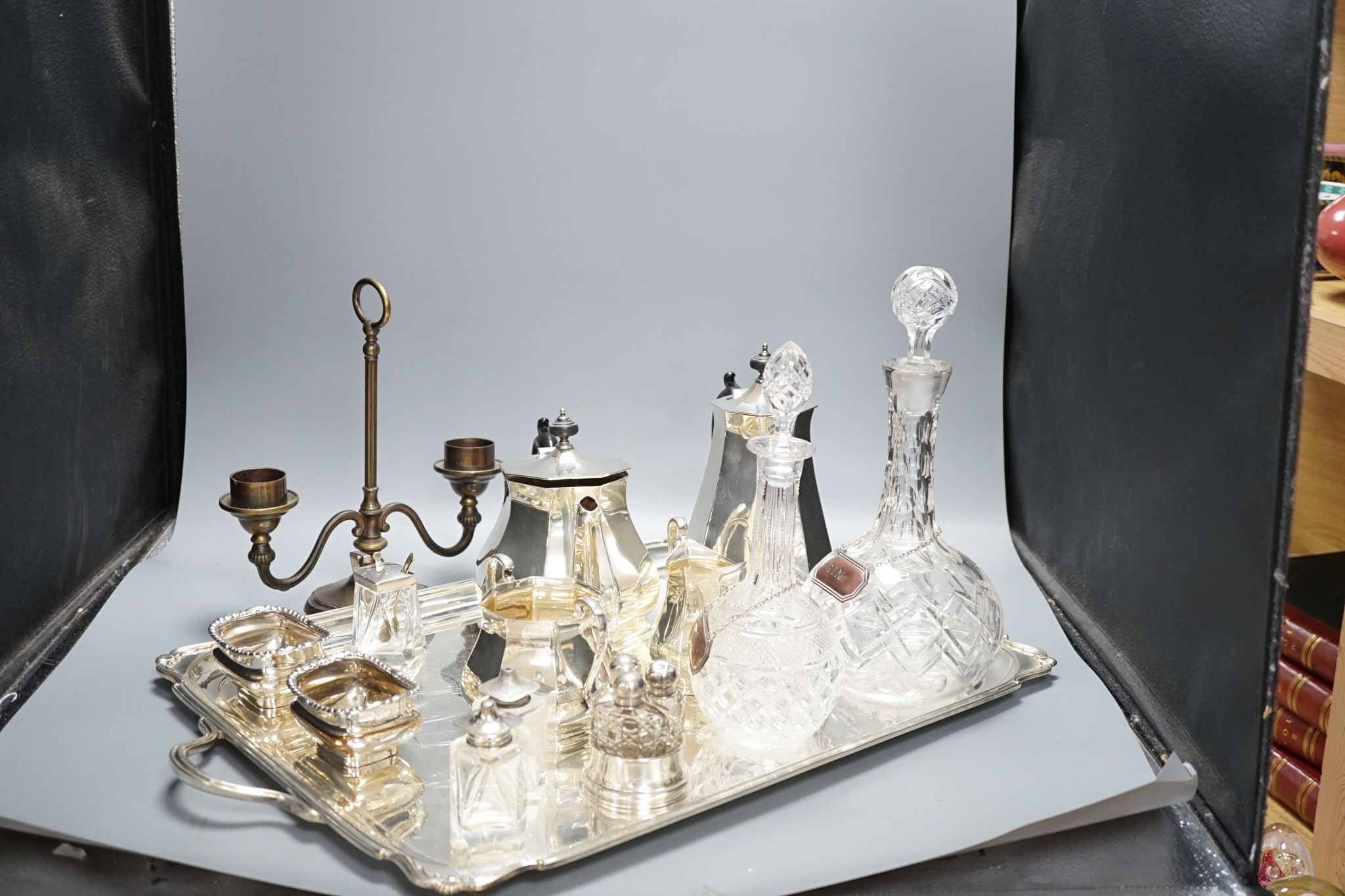 A quantity of silver plated tea/coffee wares including two handled tray, decanters, salts etc., 62cm